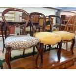 Three matching Victorian mahogany framed balloon back dining chairs - sold with a pair similar -