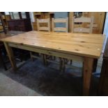 A 6' modern polished pine kitchen dining table, set on heavy square tapered legs