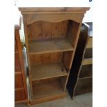 A 17 1/2" waxed pine three shelf open bookcase with plinth base