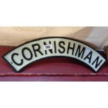 A reproduction painted cast iron Cornishman train sign