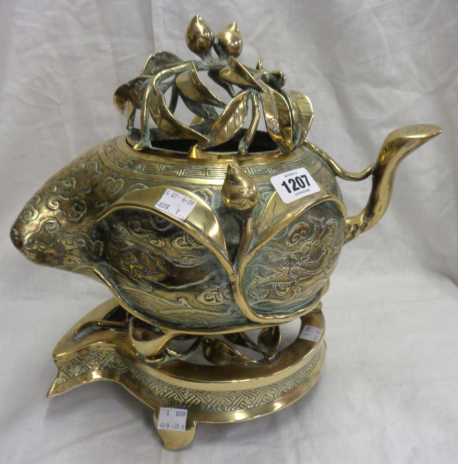 An antique Chinese bronze censer of asymmetric form with engraved air dragon and meandering - Image 2 of 13