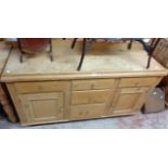 A 5' late 20th Century Cottage Furniture waxed pine dresser base with low raised back,