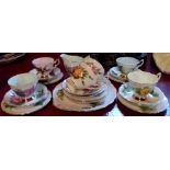 A Paragon part tea set with rose pattern comprising cream jug, sandwich plate and six trios