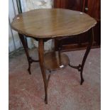 A 27" Edwardian polished oak two-tier occasional table with slender cabriole supports