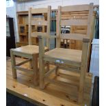 A set of six blonde wood ladder back dining chairs with solid sectional seats, set on square
