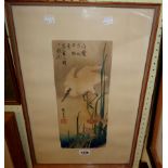 A framed 1920's oriental coloured print, depicting of a crane and lilies, text and seal mark