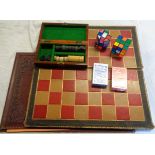 A leather covered chess board, two Rubiks cubes, etc.