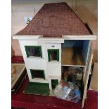 A vintage 1930's style doll's house and furniture