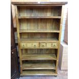 A 3' 7" modern Eastern hardwood and stone inlaid four shelf open bookcase with two central frieze