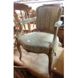 A 20th Century French style polished wood show frame salon armchair with tapestry upholstery and