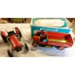 A boxed tinplate model Fiat Car - sold with a model of a vintage Massey Ferguson tractor
