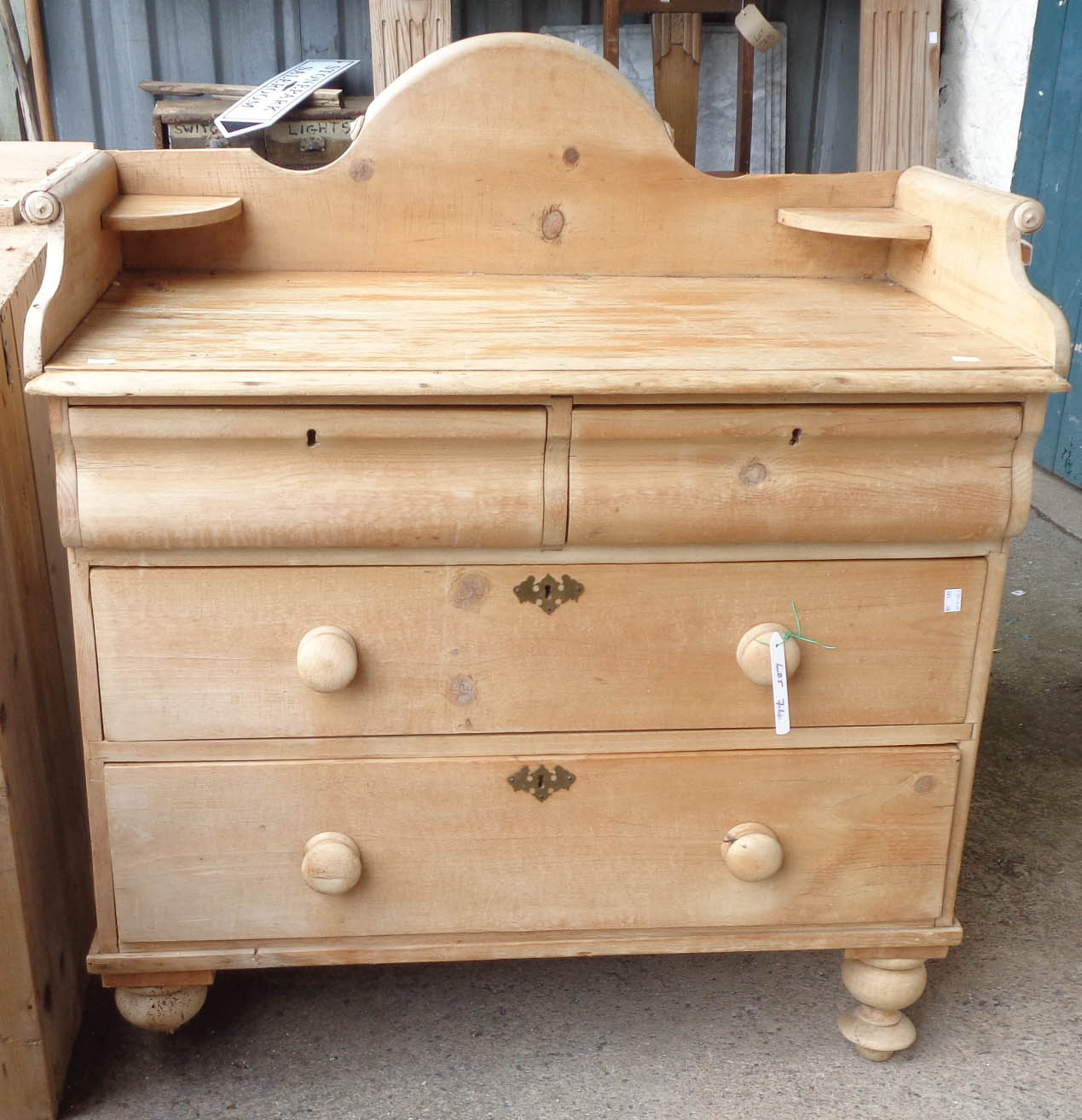 A 3' 1" antique pine washstand chest with splash back and shelves over two short and two long