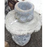 A cast concrete bark effect pot and stand