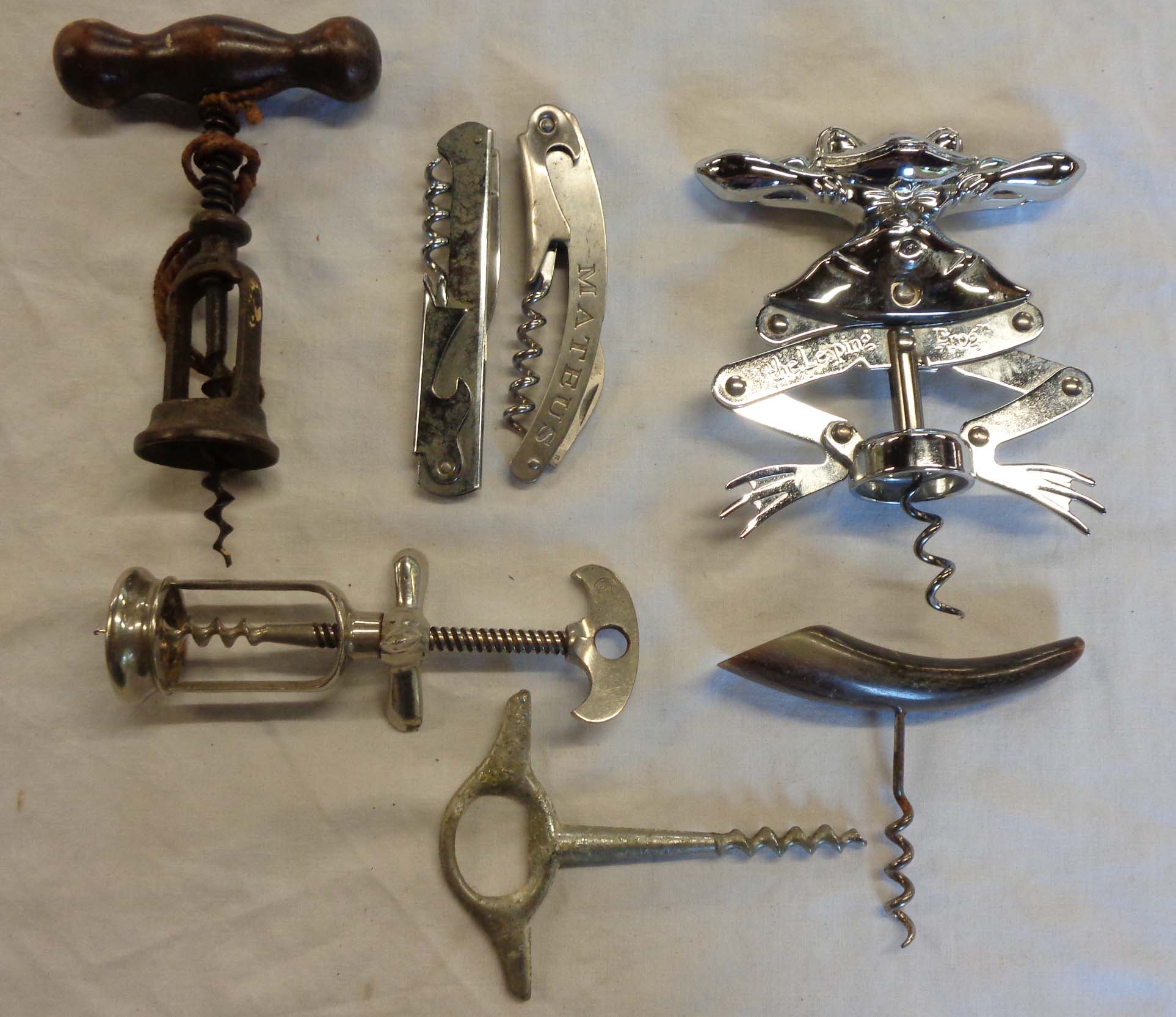 A collection of various corkscrews including Leaping Frog, Mateus, etc.