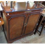 A 34" reproduction mahogany and cross banded television cabinet