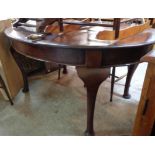 A late Victorian mahogany D-end extending dining table, with single leaf and winder, set on heavy
