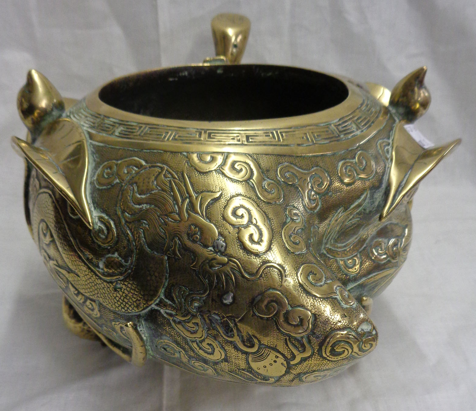An antique Chinese bronze censer of asymmetric form with engraved air dragon and meandering - Image 8 of 13