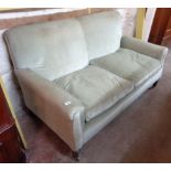 A 5' 4" early 20th Century single drop-end two seater settee upholstered in frosted pale green