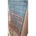 A 32 1/2" wrought iron garden gate and railing section