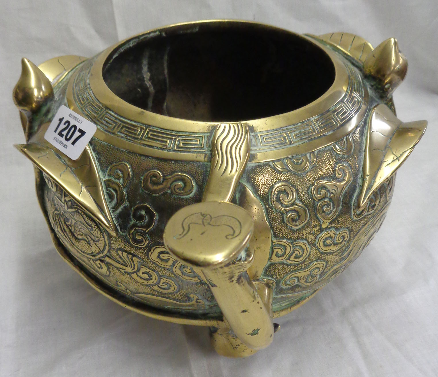 An antique Chinese bronze censer of asymmetric form with engraved air dragon and meandering - Image 7 of 13