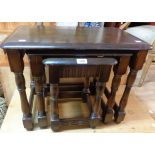 A nest of three Priory Corner polished wood tea tables, set on turned supports