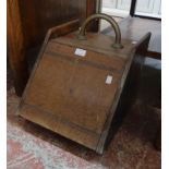 A late Victorian oak slope fronted coal box with brass handle and metal liner - a/f.