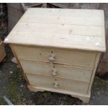 A 26" waxed pine chest of three long graduated drawers, set on bracket feet - feet a/f