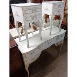 A 4' French style white painted and parcel gilt dressing table with central frieze drawer and four