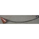 An antique wrought iron and copper candle snuffer