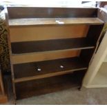 A 30 1/2" polished oak four shelf open waterfall bookcase