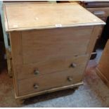 A 25 1/2" Victorian waxed pine commode chest with china liner, set on turned feet