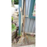 An antique hay fork and rustic rake