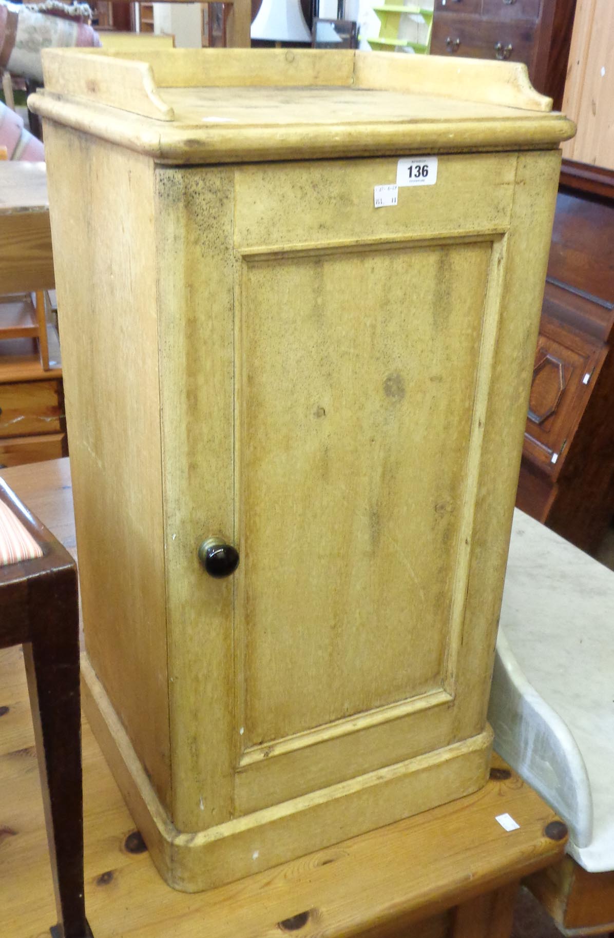 A 15 3/4" Victorian pine pot cupboard with gallery and panelled door