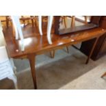 A retro McIntosh & Co Ltd., Kirkcaldy, Scotland polished teak extending dining table featuring two