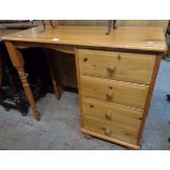 A 3' 1" modern polished pine single pedestal dressing table with four drawers, turned front supports