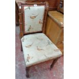 A late Victorian polished oak framed drawing room standard chair with upholstered back and seat