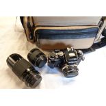 A Nikon FA 35mm camera with Nikon 50mm Series E f:1.8 lens - sold with a Nikon Teleconverter and a