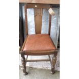 A set of four 1930's oak framed dining chairs with drop-in seats, set on turned front supports