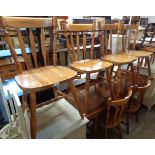 Set of eight 20th Century polished pine kitchen chairs with solid sectional seats, set on turned