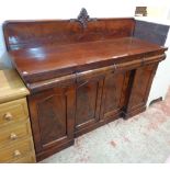 A 5' Victorian flame mahogany sideboard with low raised back, three blind cushion frieze drawers,