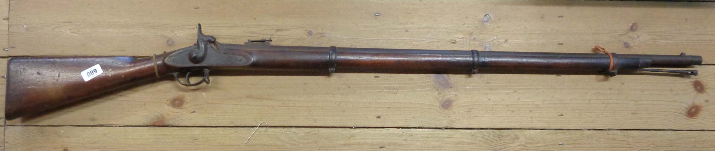 A mid 19th Century three-banded percussion musket with flip-up rear sight and 40" barrel - overall