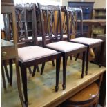 A set of six early 20th Century walnut framed dining chairs with harebell swag decorated pierced