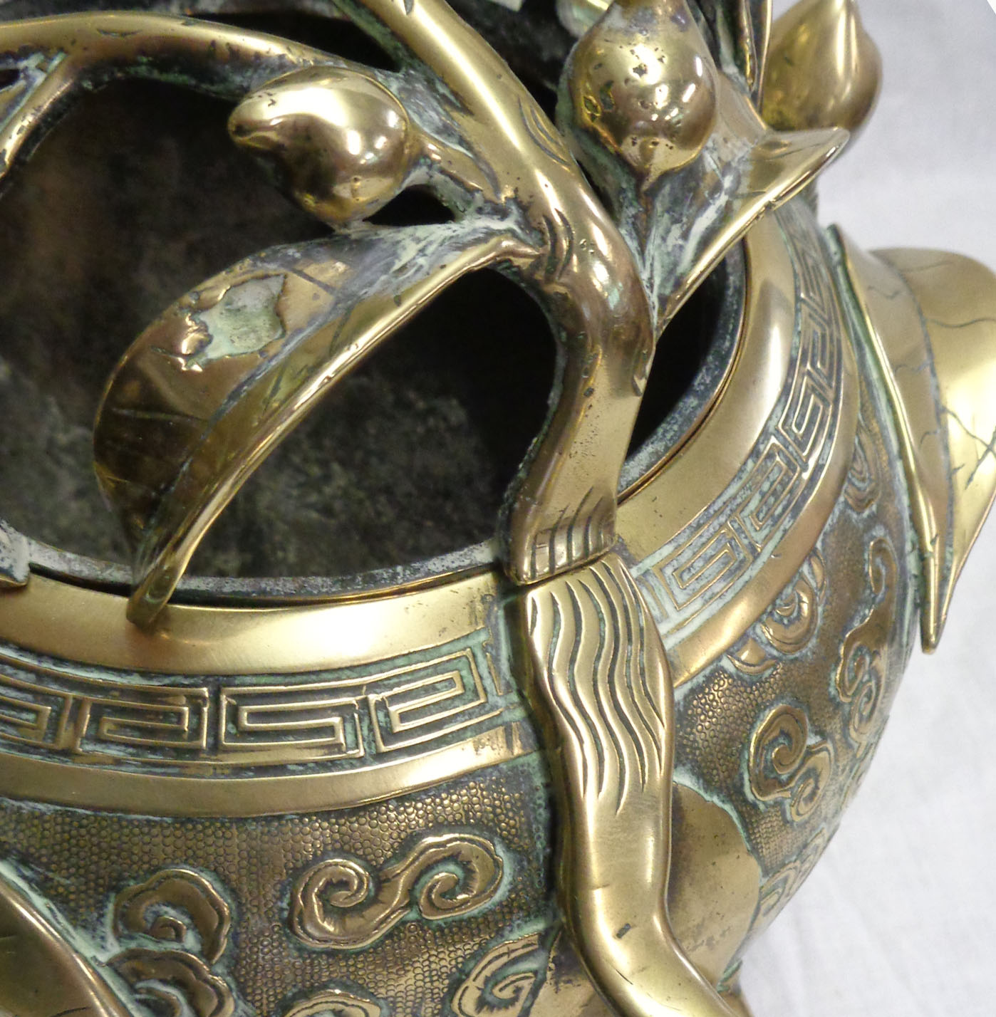 An antique Chinese bronze censer of asymmetric form with engraved air dragon and meandering - Image 13 of 13