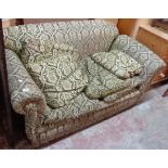A 5' 6" Edwardian single drop-end settee with original upholstery and scatter cushions - a/f.