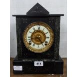 A late Victorian black slate and marble cased mantel clock with Ansonia gong striking movement