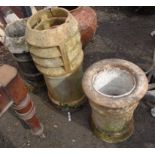 Three chimney pots of various design