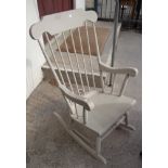 A painted wood high stick back rocking chair, set on ring turned supports