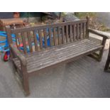 A slatted wood garden bench - length 5' 10"