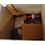 A box containing a collection of sewing and other items including small magnifying glass,