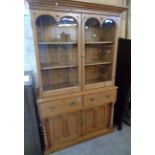 A 48 1/2" Victorian waxed pine two part dresser with moulded cornice and Gothic style detailing to